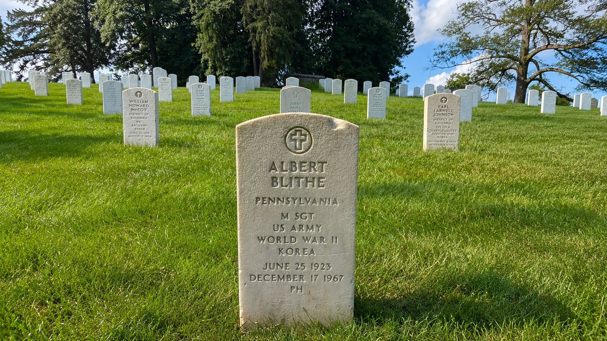 Master Sergeant Albert Blithe's headstone at Arlington National Cemetery showing his dates June 25 1923 to December 17 1967 and service in WWII and Korea
