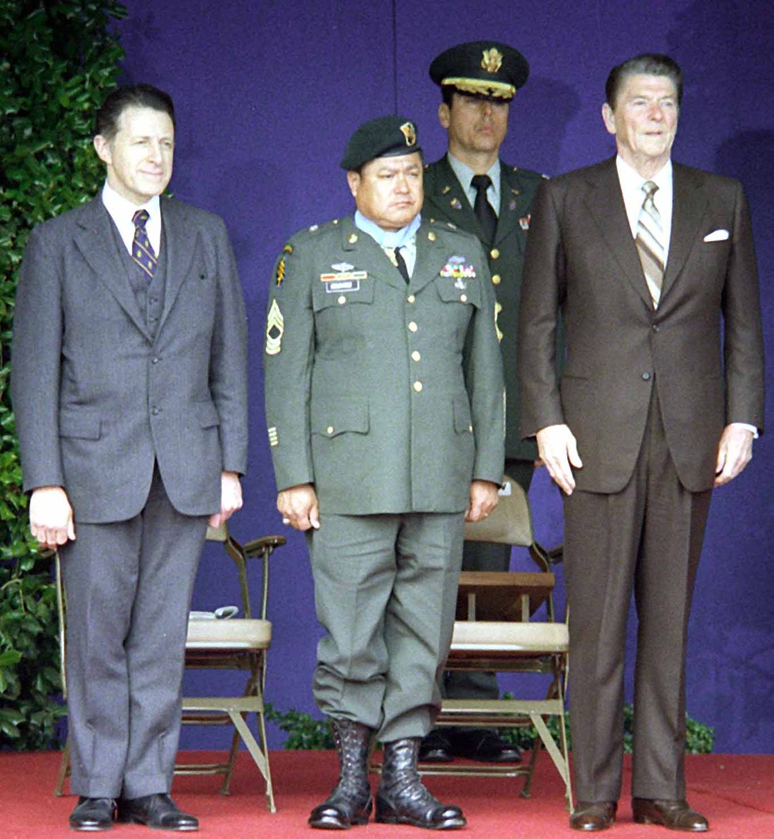 Roy Benavidez wearing the Medal of Honor stands between Defense Secretary Caspar Weinberger and President Ronald Reagan in 1981