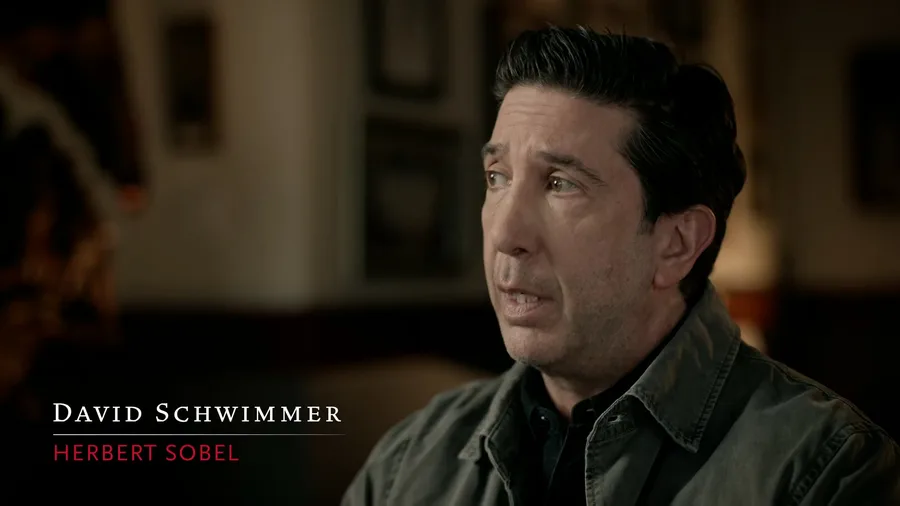 David Schwimmer in Band of Brothers: Legacy, captioned on screen as Herbert Sobel, the role he played.